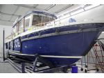 Targa 31 Sir Robert Peel II undergoing repairs to the fendering in the new GRP repair and paint shop. Scratches on the hull are also in evidence.